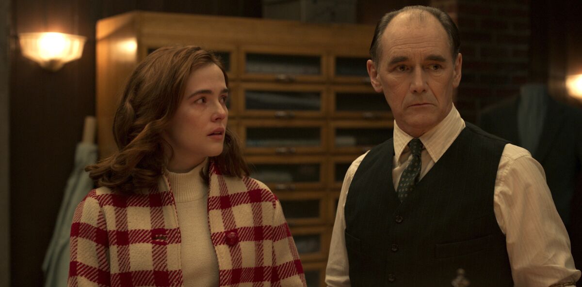 A young woman and an older man in the movie “The Outfit”