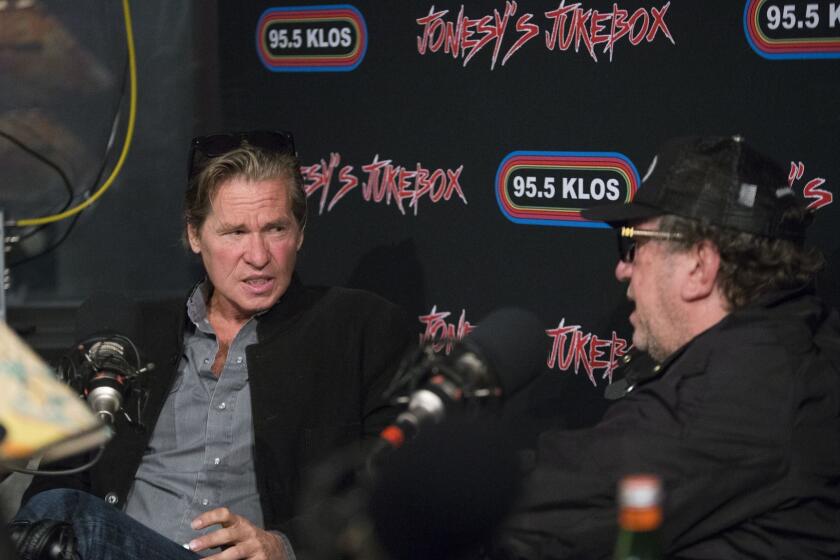 CULVER CITY, CALIF. -- FRIDAY, FEBRUARY 3, 2017: Steve Jones, 61, right, a guitarist from the punk band Sex Pistols, lives in Los Angeles and is a DJ on Jonesy's Jukebox on KLOS, and interviews actor Val Kilmer, not pictured. He tells the story of his youth in his new memoir "Lonely Boy." Photos taken at KLOS in Culver City, Calif., on Feb. 3, 2017. (Allen J. Schaben / Los Angeles Times)