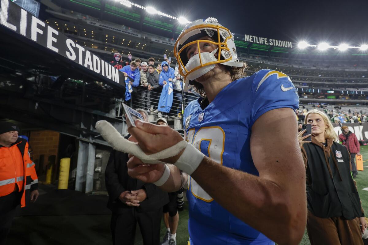 Chargers quarterback Justin Herbert (10) is still playing with a bandage on his injured hand.