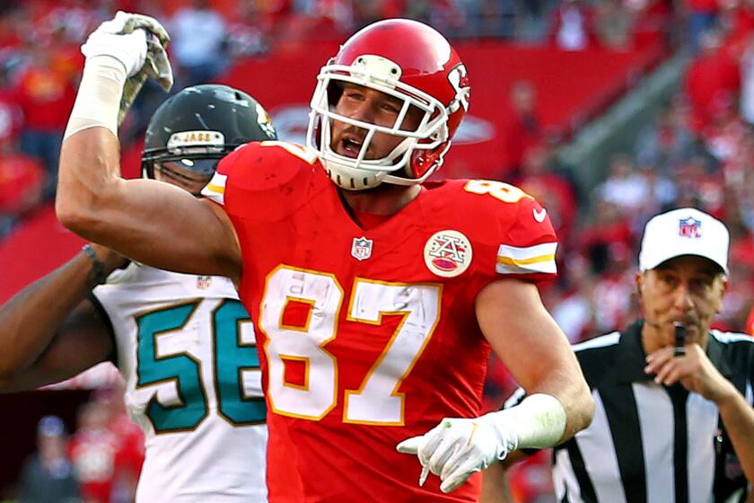 Chiefs tight end Travis Kelce (87) throws a towel toward field judge Mike Weatherford (not pictured) in protest for not getting a penalty call.