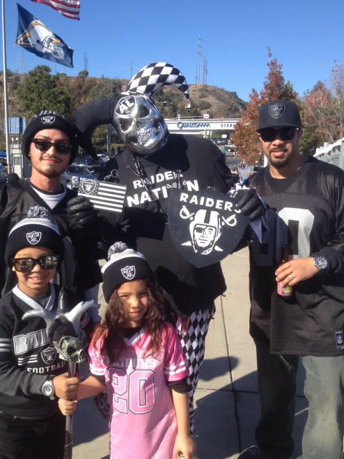 Barry Weatherspoon (left bottom) and sister Haylee (pink) showing off their Raider gear as children.