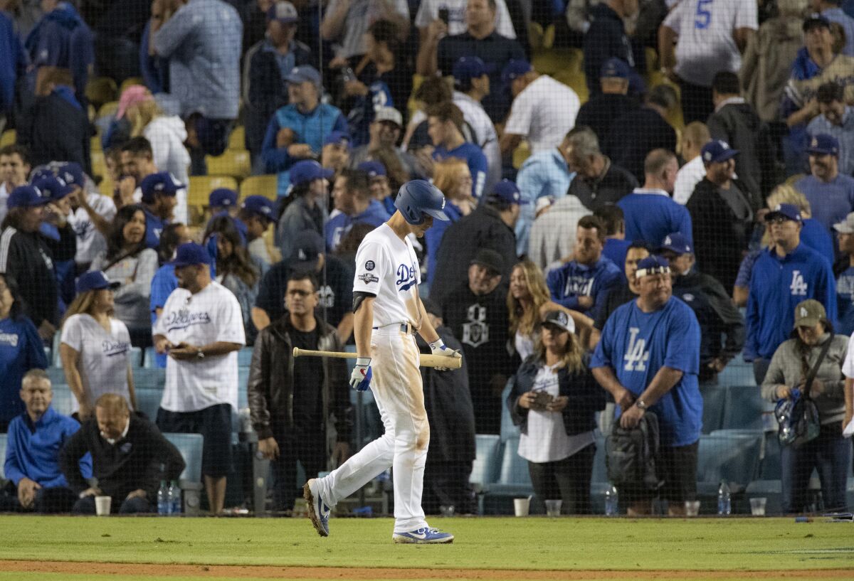 Los Angeles Dodgers shortstop Corey Seager (5) walks back to the dugout after striking out with bases loaded against Washington Nationals relief pitcher Daniel Hudson (44) in the bottom of the 9th inning of Game 2 of the NLDS.