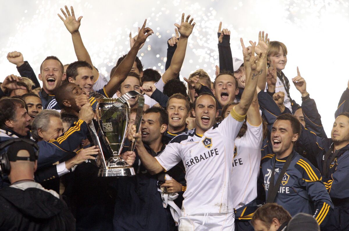 Galaxy players, including Landon Donovan, center, celebrate after winning the 2011 MLS Cup championship.