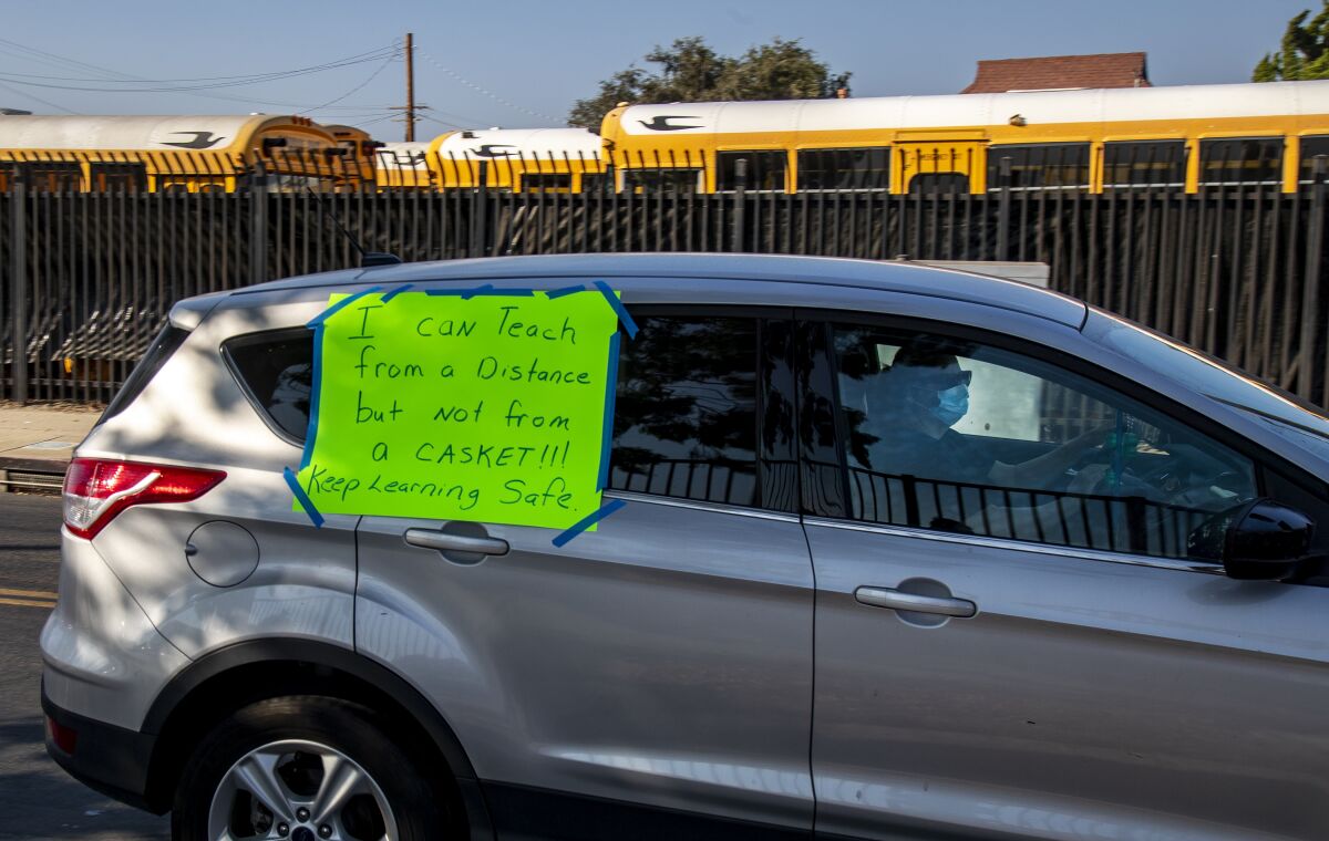Compton Unified School District teachers participate this month in a car caravan protest.