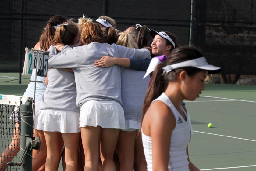 Corona del Mar High High School girls' tennis team celebrate after winning the CIF Southern Section Division 1 title against Marlborough at the Claremont Club in Claremont, Ca., Friday, November 15, 2019. (photo by James Carbone)