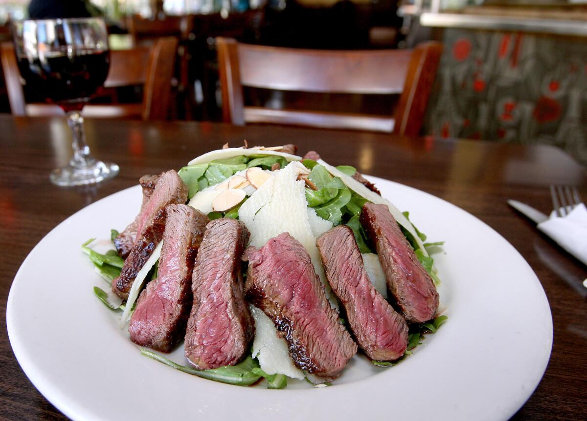 The Tagliata steak salad includes grilled steak, wild baby arugula, shaved parmesan cheese and toasted almonds with house-made lemon vinaigrette, from Novo Cafe at 3900 W. Riverside Dr. in Burbank on Thursday, November 12, 2015.