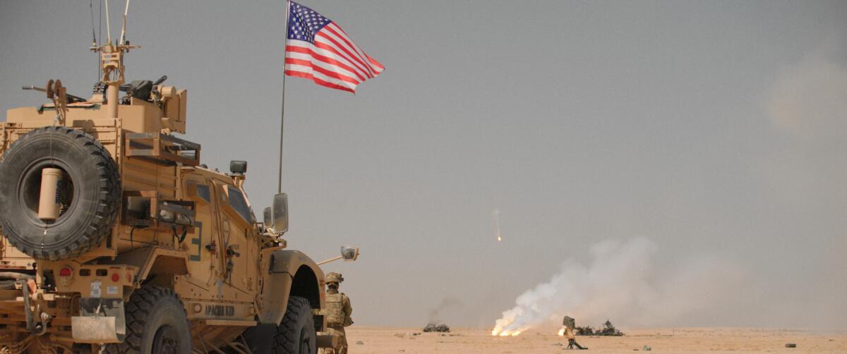 A military vehicle with a U.S. flag in the desert in the documentary "Retrograde."