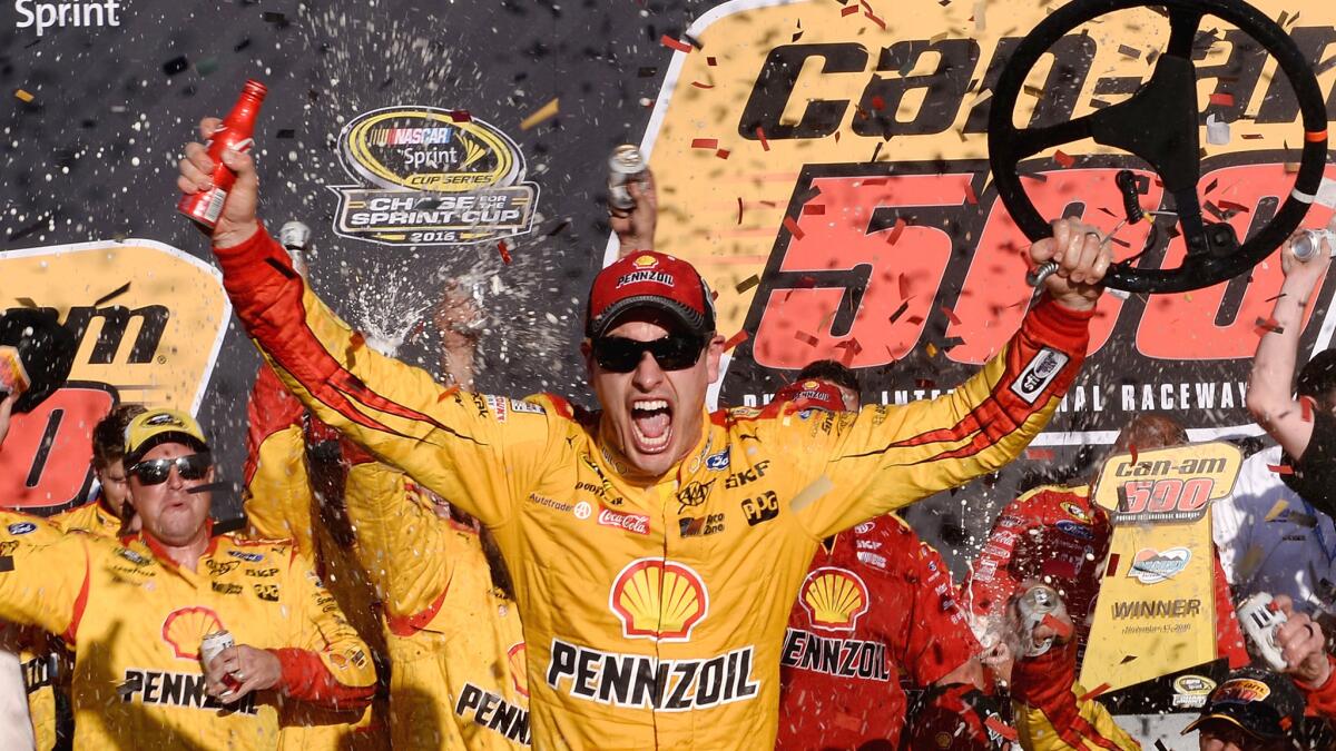 NASCAR driver Joey Logano celebrates in Victory Lane after winning the Sprint Cup Series Can-Am 500 at Phoenix International Raceway on Sunday.