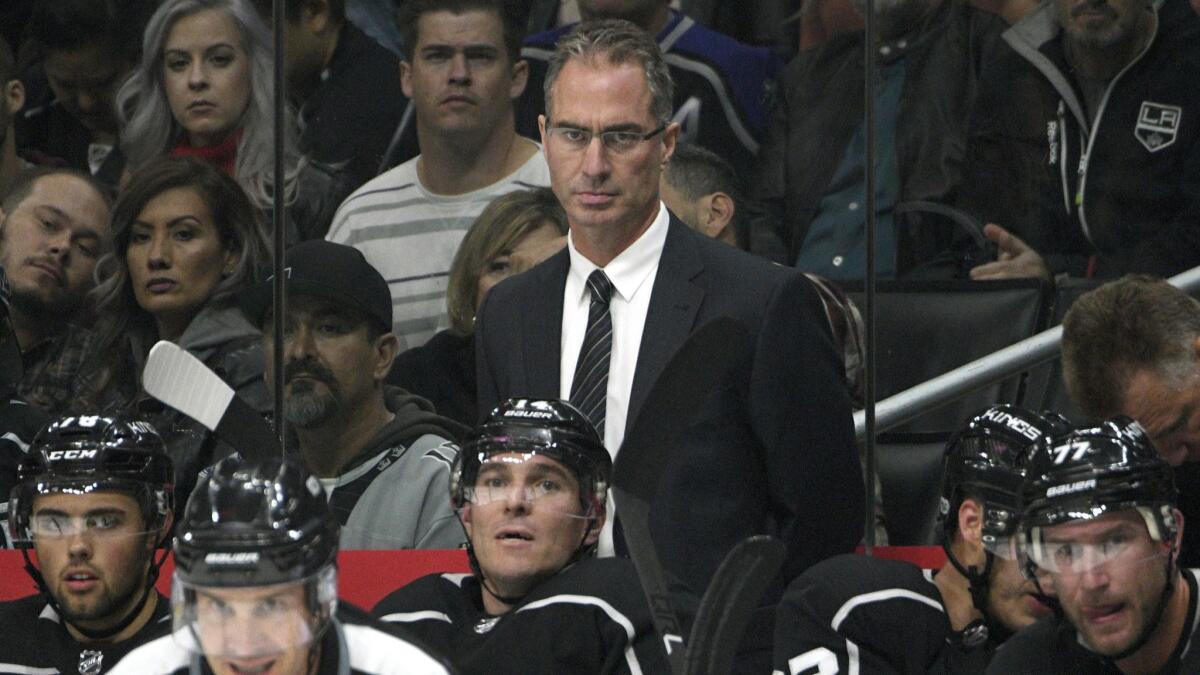 Kings head coach John Stevens looks on from the bench during a preseason game against the Ducks.