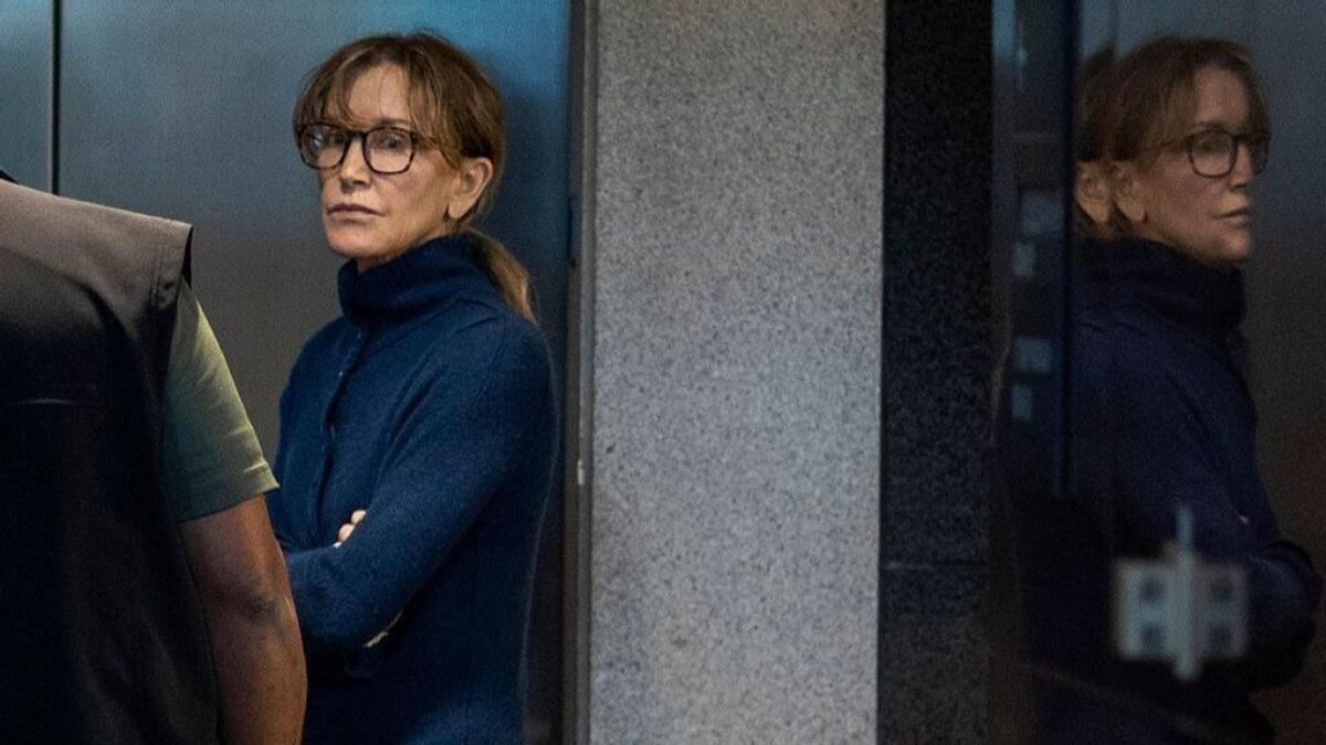 Actress Felicity Huffman, who was arrested in connection with a college admissions scandal, is seen inside the Edward R. Roybal Federal Building and U.S. Courthouse in Los Angeles on March 12.