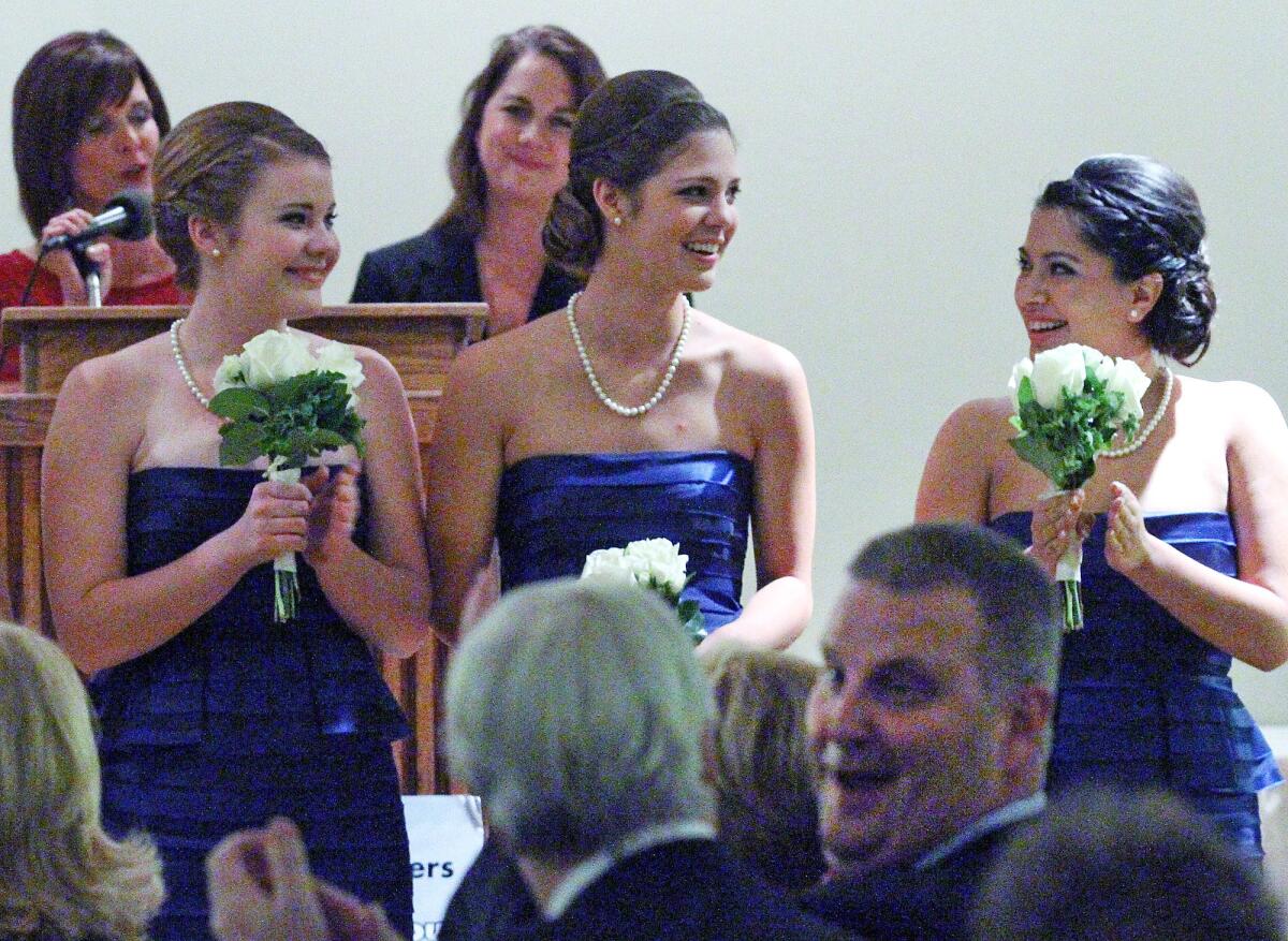 Kaitlin Powers, center, is applauded by Caroline Kenney and Sabine Puglia after she is named Miss La Canada Flintridge 2014 at the 102nd Installation and Awards Gala for the La Canada Flintridge Chamber of Commerce and Community Association at the La Canada Flintridge Country Club on Thursday, January 16, 2014. The Announcement and Coronation of Miss La Canada Flintridge 2014 and Her Royal Court also took place. (Tim Berger/Staff Photographer)