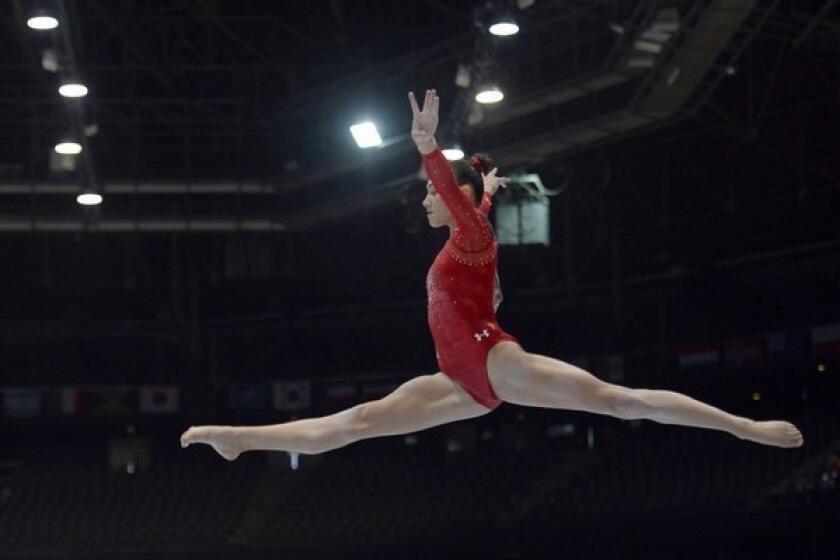 Kyla Ross competes on the balance beam at the 2013 World Championships in Antwerp, Belgium.
