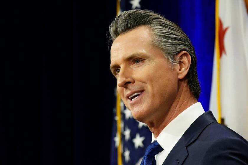 FILE - California Gov. Gavin Newsom delivers his annual State of the State address in Sacramento, Calif., Tuesday, March 8, 2022. On Tuesday, March 22, 2022, Newsom signed a law that will make abortions cheaper for people on private insurance plans. The new law bans private insurers from charging things like co-pays and deductibles for abortion services starting Jan. 1, 2023. (AP Photo/Rich Pedroncelli, File)