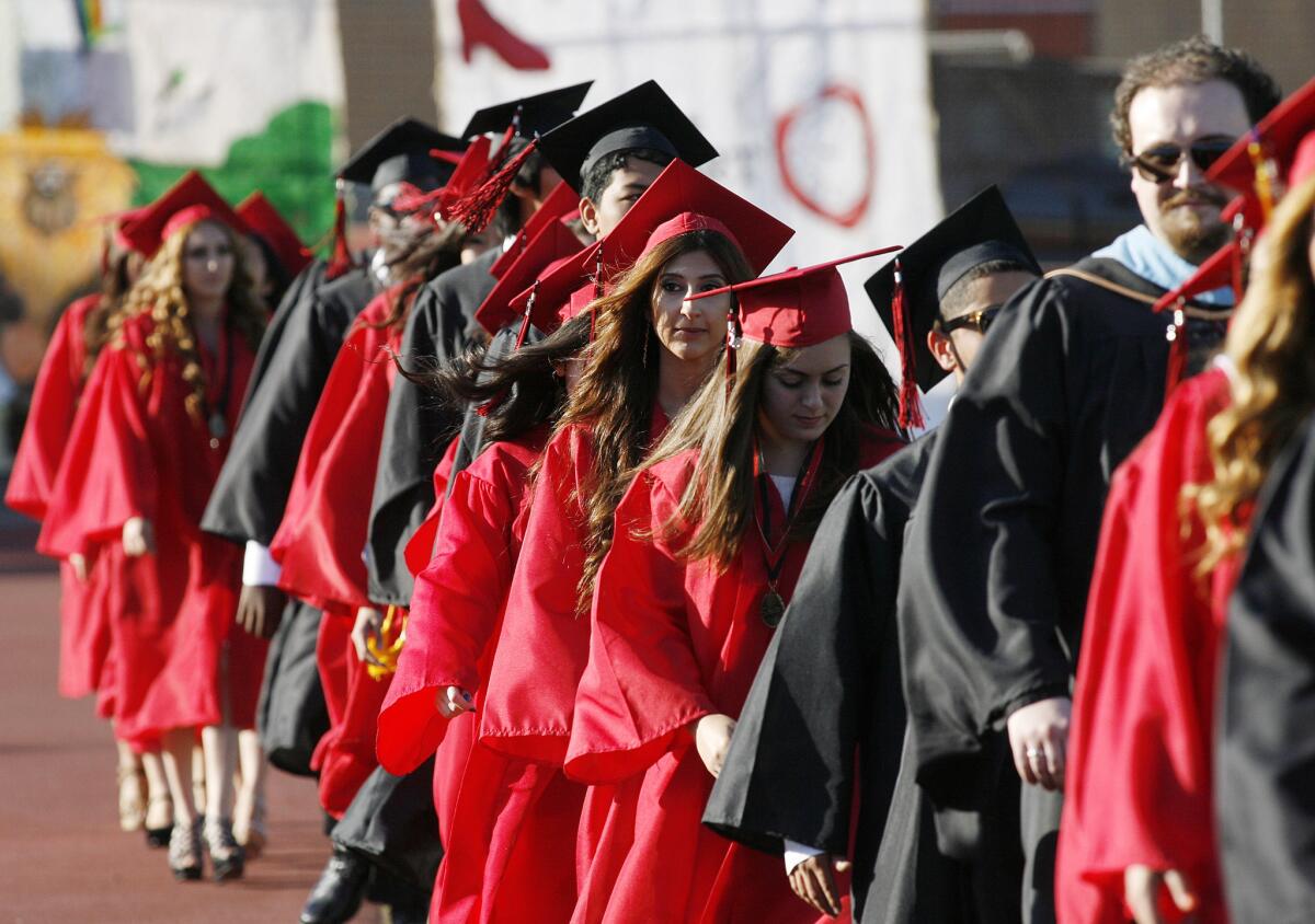 A line of graduates enter graduation ceremonies for Glendale High School on Tuesday, June 4, 2013.