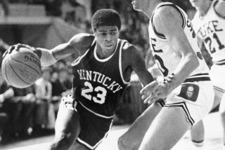 Kentucky star Dwight Anderson drives past Duke University's Jim Suddath during a game on Nov. 19, 1979.