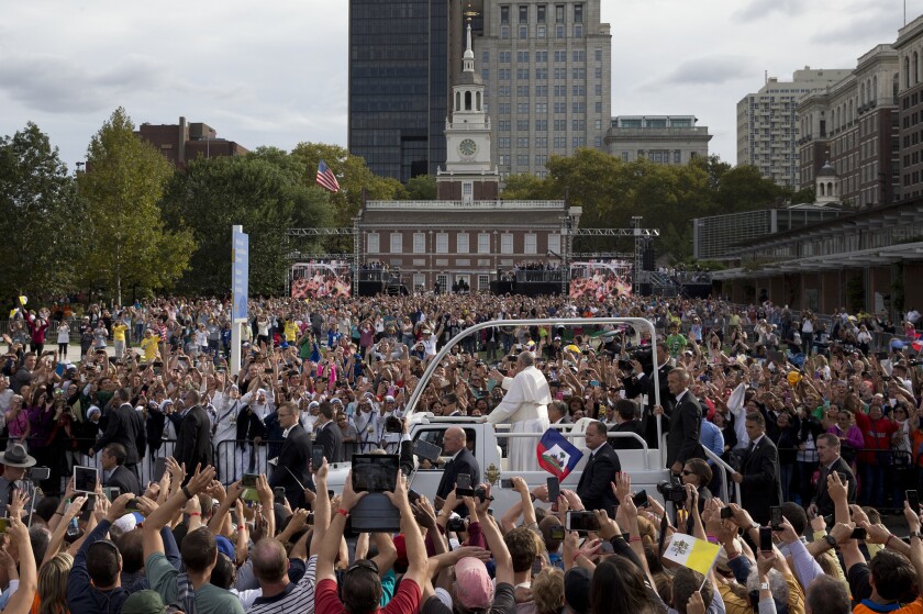 Pope Francis rides in the popemobile along Independence Mall before delivering a speech outside Independence Hall on Sept. 26, 2015, in Philadelphia.