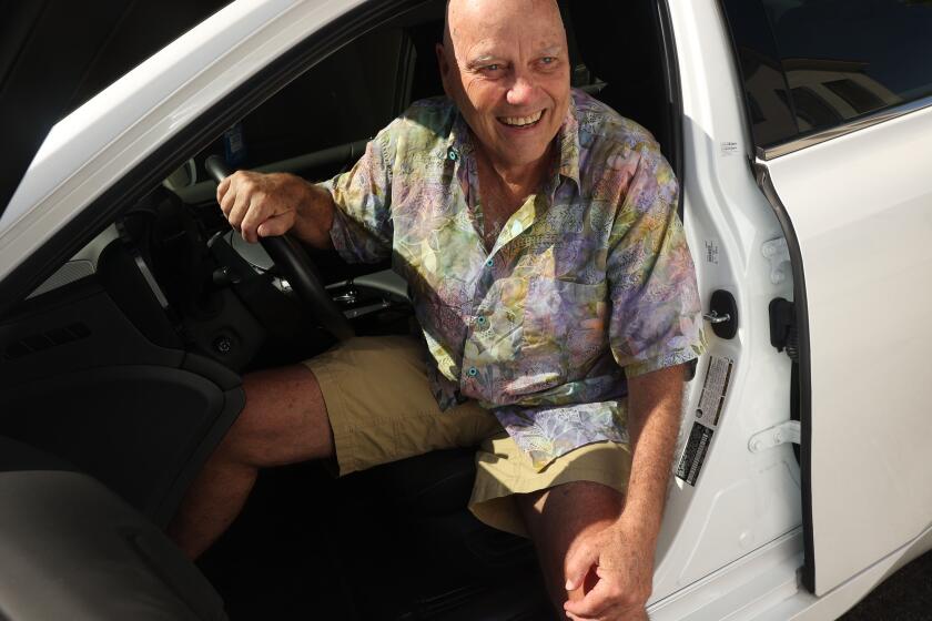 Los Angeles, CA - August 07: Bryan Caluwe poses for a portrait with his Toyota Mirai, a fuel cell car on Wednesday, Aug. 7, 2024 in Los Angeles, CA. (Michael Blackshire / Los Angeles Times)