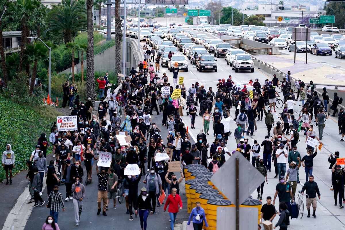 Protesters, outraged over the death of George Floyd, take to the streets in downtown L.A. on May 29, 2020.