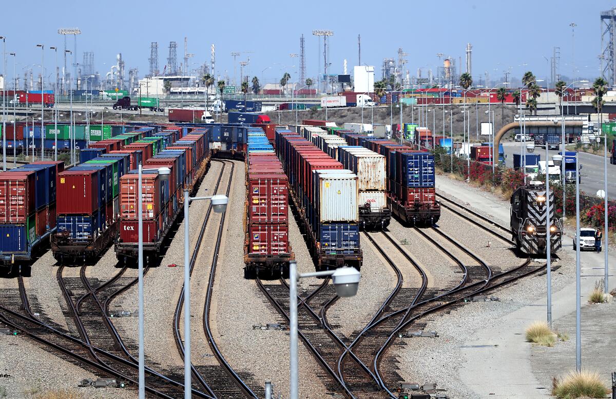 Containers on rail cars.