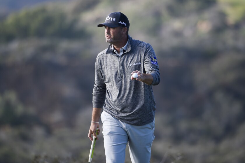 Ryan Palmer reacts after birdieing the par-five 17th on the North Course at Torrey Pines on Friday.