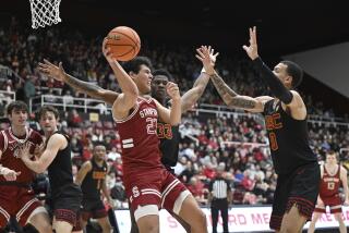 Stanford forward Brandon Angel (23) fights for the ball with USC forward Kijani Wright (33) and guard Kobe Johnson.