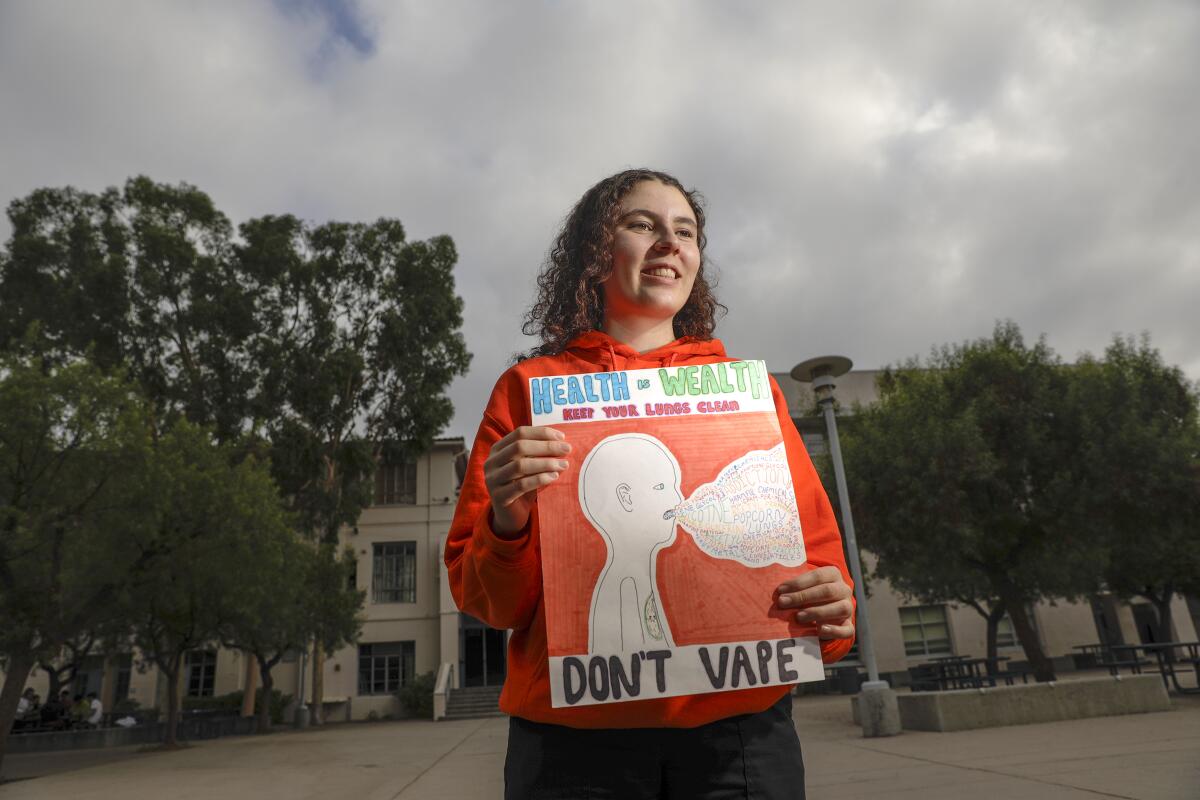 Crescenta Valley High School student Lucy Levine with her anti-vaping poster