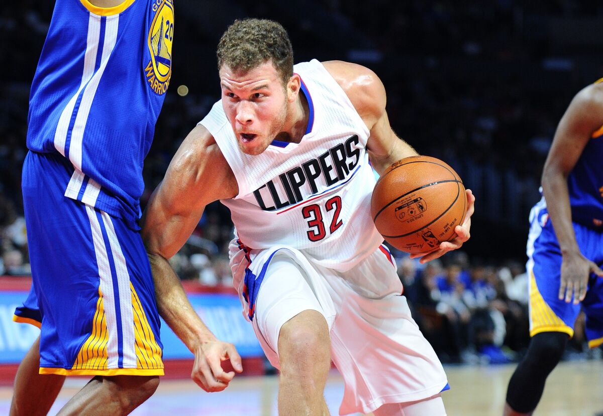 Blake Griffin drives on the the Warriors at Staples Center on Oct. 20, 2015.