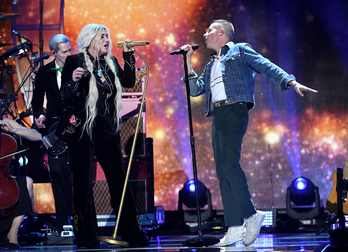 Kesha (L) and Macklemore perform onstage during the 2017 iHeartRadio Music Festival at T-Mobile Arena on September 23, 2017 in Las Vegas, Nevada. (Photo by Kevin Winter/Getty Images for iHeartMedia)