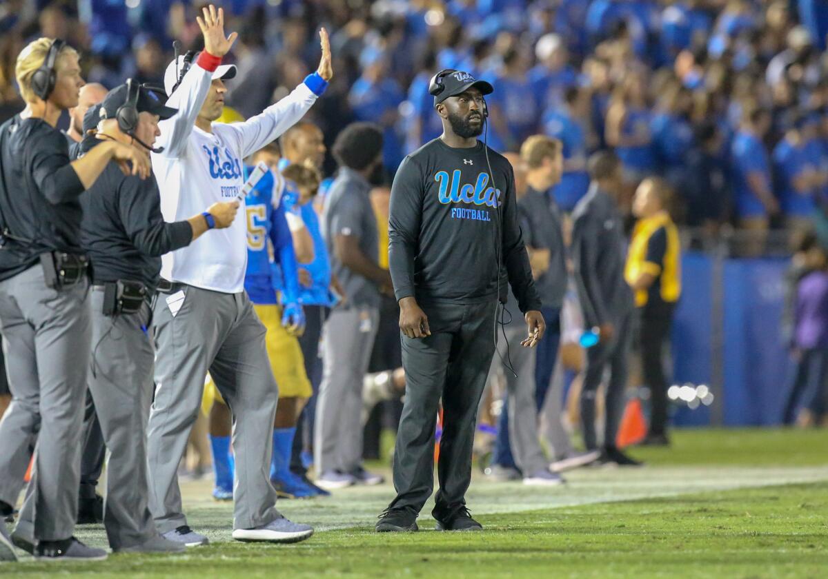 Then-UCLA running backs coach DeShaun Foster stands on the sideline during a game against Washington in October 2018.