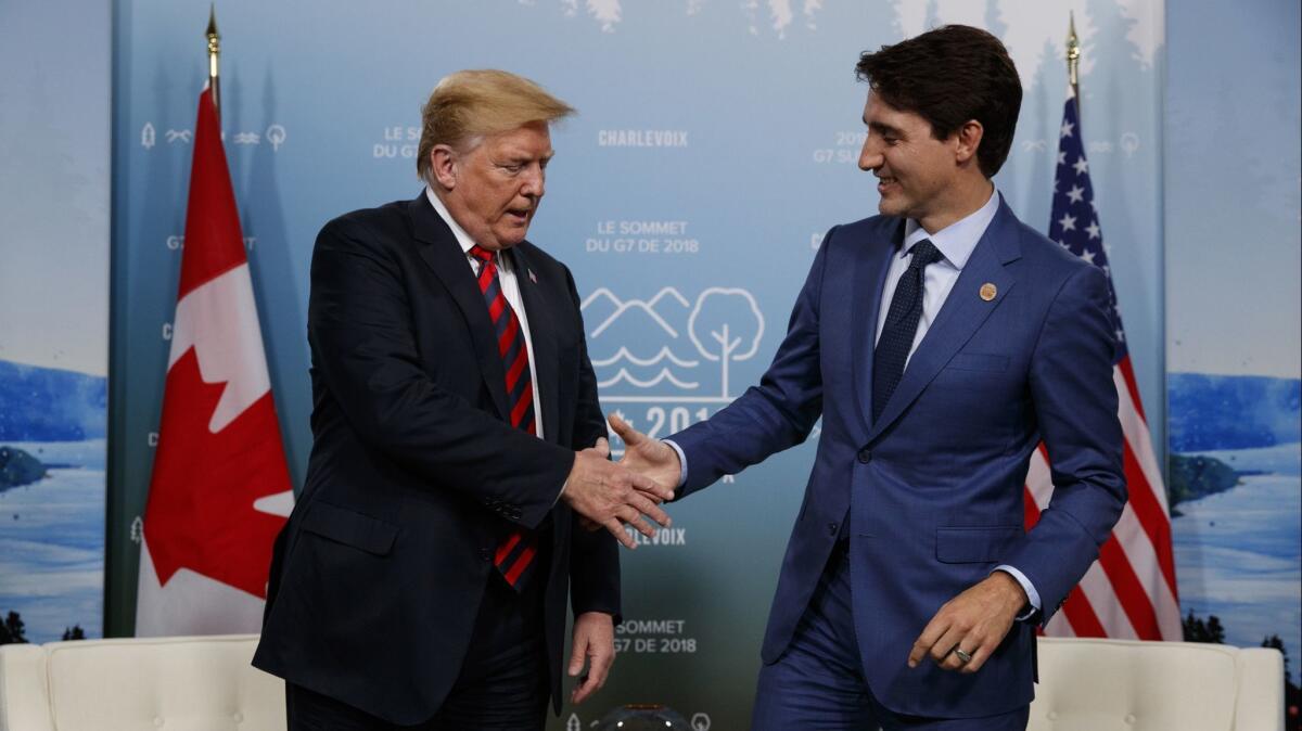 President Trump shakes hands with Canadian Prime Minister Justin Trudeau during a meeting at the G-7 summit on Friday in Charlevoix, Canada.
