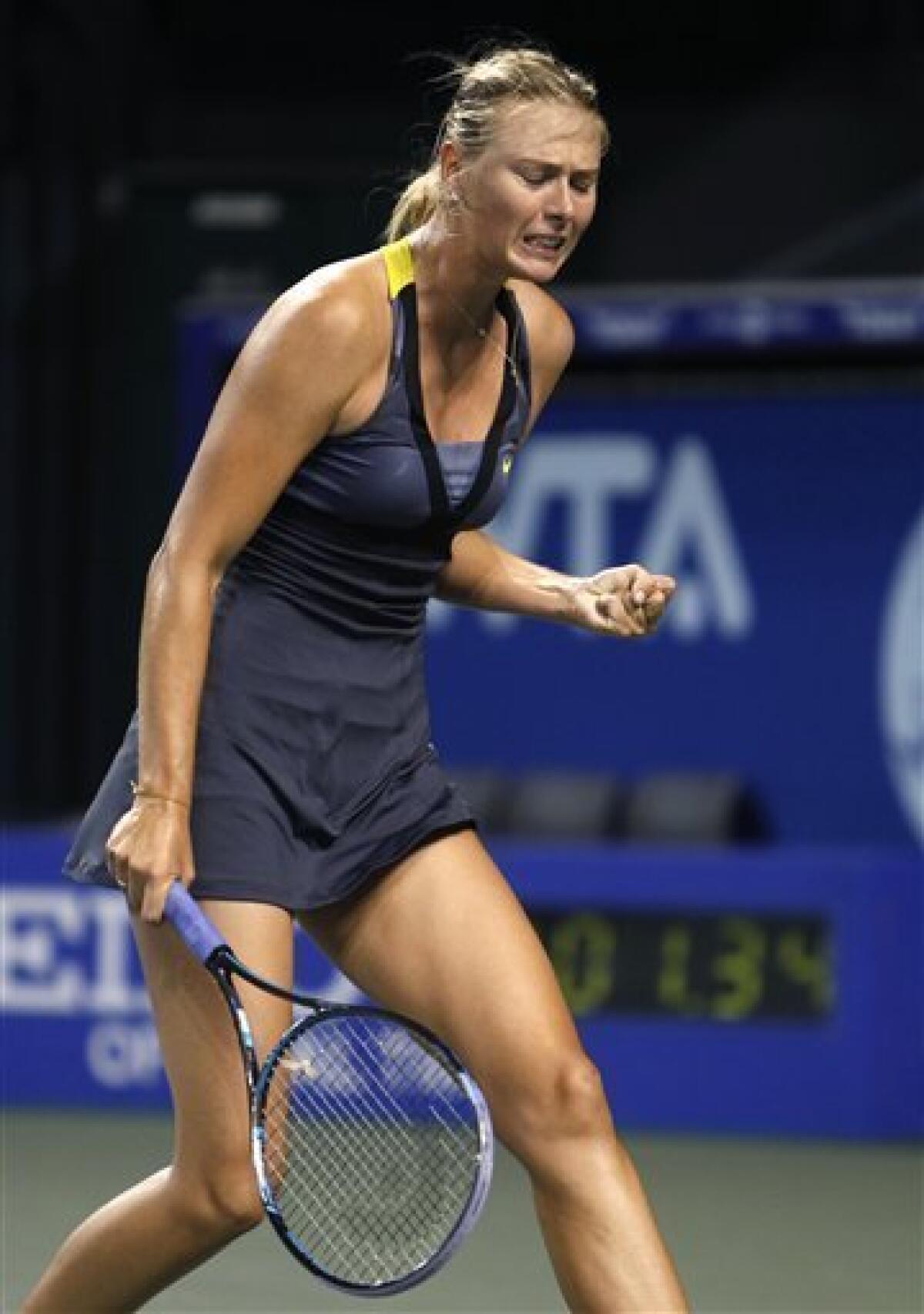 Maria Sharapova of Russia reacts to winning a point against Tamarine Tanasugarn of Thailand during their second round match of the Japan Pan Pacific Open tennis tournament in Tokyo, Monday, Sept. 26, 2011. Sharapova won the match, 6-2, 7-5. (AP Photo/Shizuo Kambayashi)