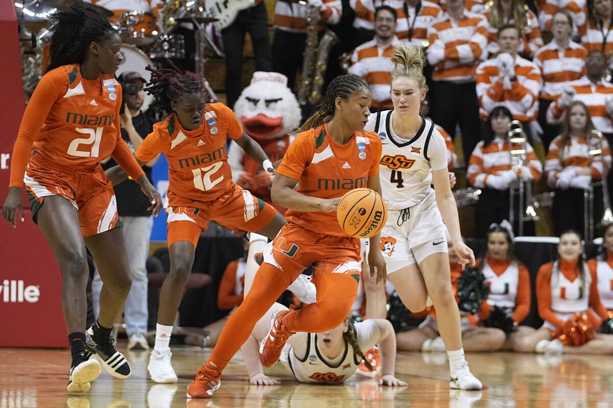 Miami's Jasmyne Roberts (4) tracks down a loose ball during the second half of a first-round college basketball game against Oklahoma State in the women's NCAA Tournament Saturday, March 18, 2023, in Bloomington, Ind. (AP Photo/Darron Cummings)