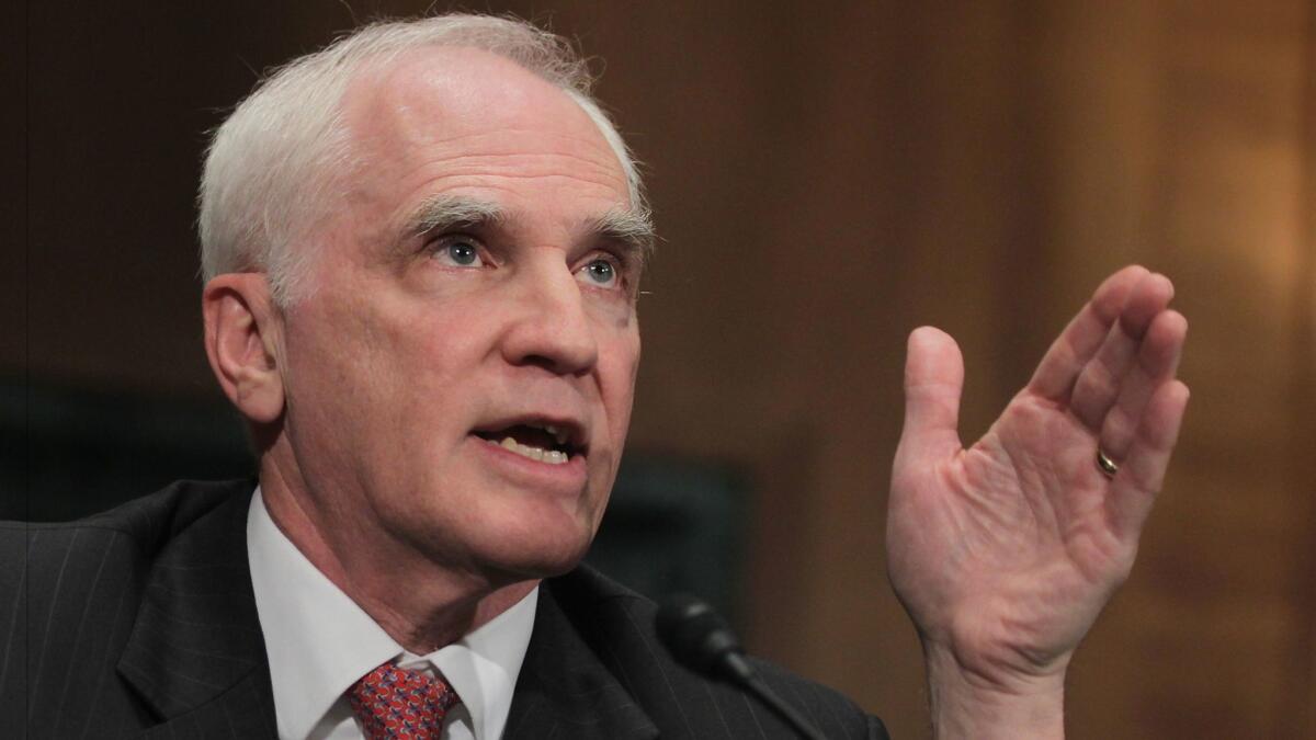 Federal Reserve Board of Governors member Daniel Tarullo testifies during a hearing on Capitol Hill in Washington in 2014.