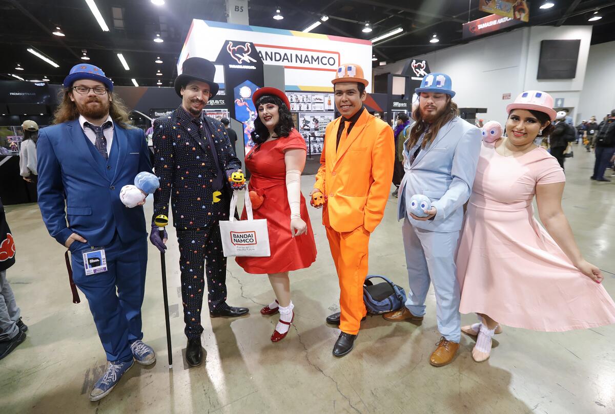 A group of cosplayers dressed as characters from the Pac-Man video game during the 2023 Wondercon.