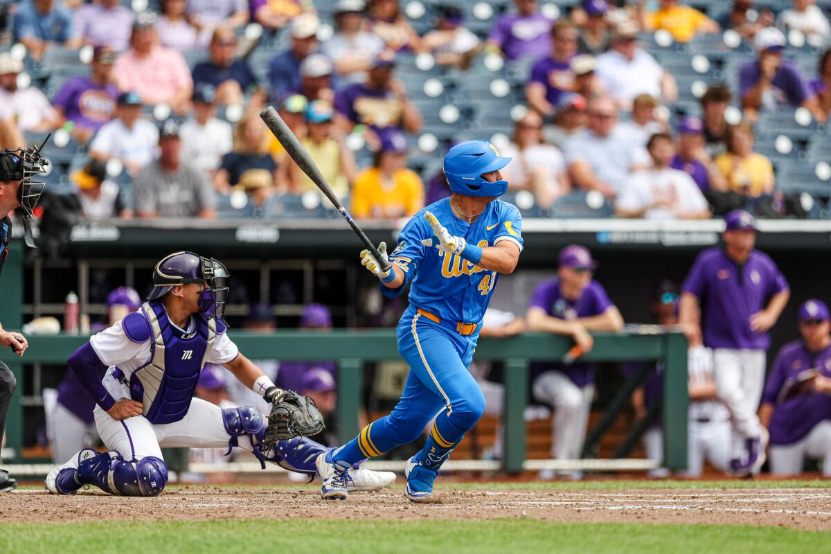 UCLA sophomore Cashel Dugger looks up after hitting the ball during a Men's College World Series game against LSU