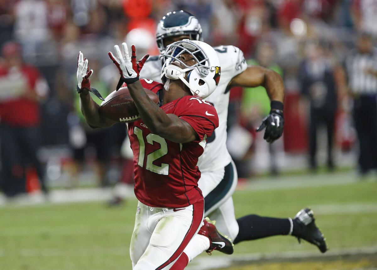 Arizona Cardinals wide receiver John Brown somehow hauls in a deep pass over his head against the Philadelphia Eagles on a 75-yard scoring play Sunday.