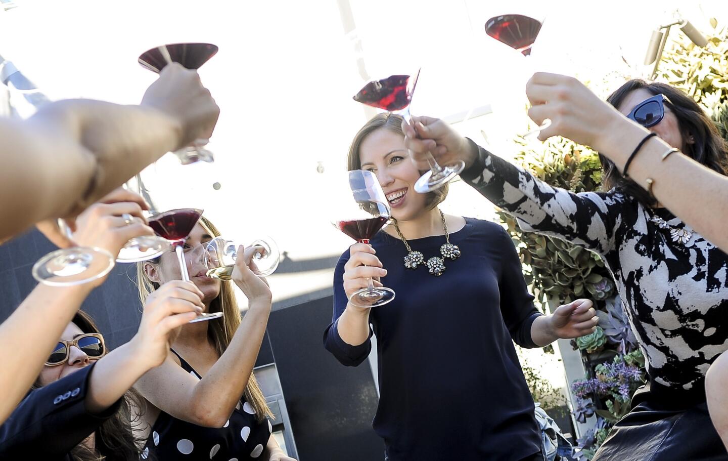 Elizabeth Huettinger, wine director at Otium restaurant, center, hosts a gathering of sommeliers and friends at her apartment building, the newly completed Emerson in downtown L.A.