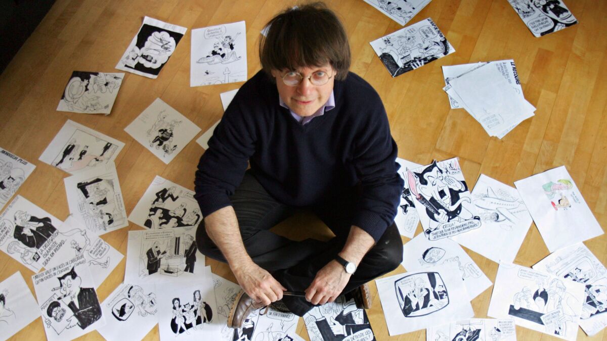French cartoonist Jean Cabut aka Cabu of the satirical newspaper Charlie Hebdo posing in his apartment. Cabu is among the deadly victims of the attack led by armed gunmen who stormed the offices Charlie Hebdo in Paris.