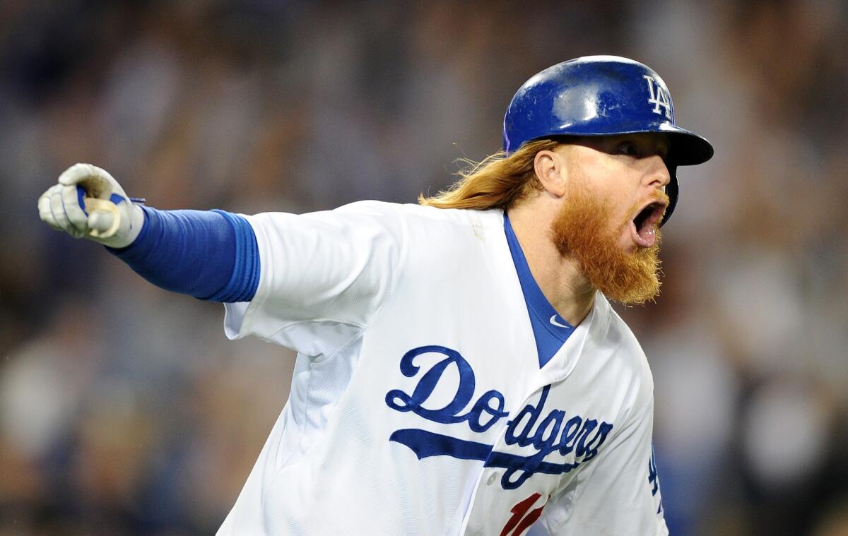 Justin Turner reacts after hitting his second home run of the night off San Francisco's Madison Bumgarner in a 4-2 victory on Sept. 23.