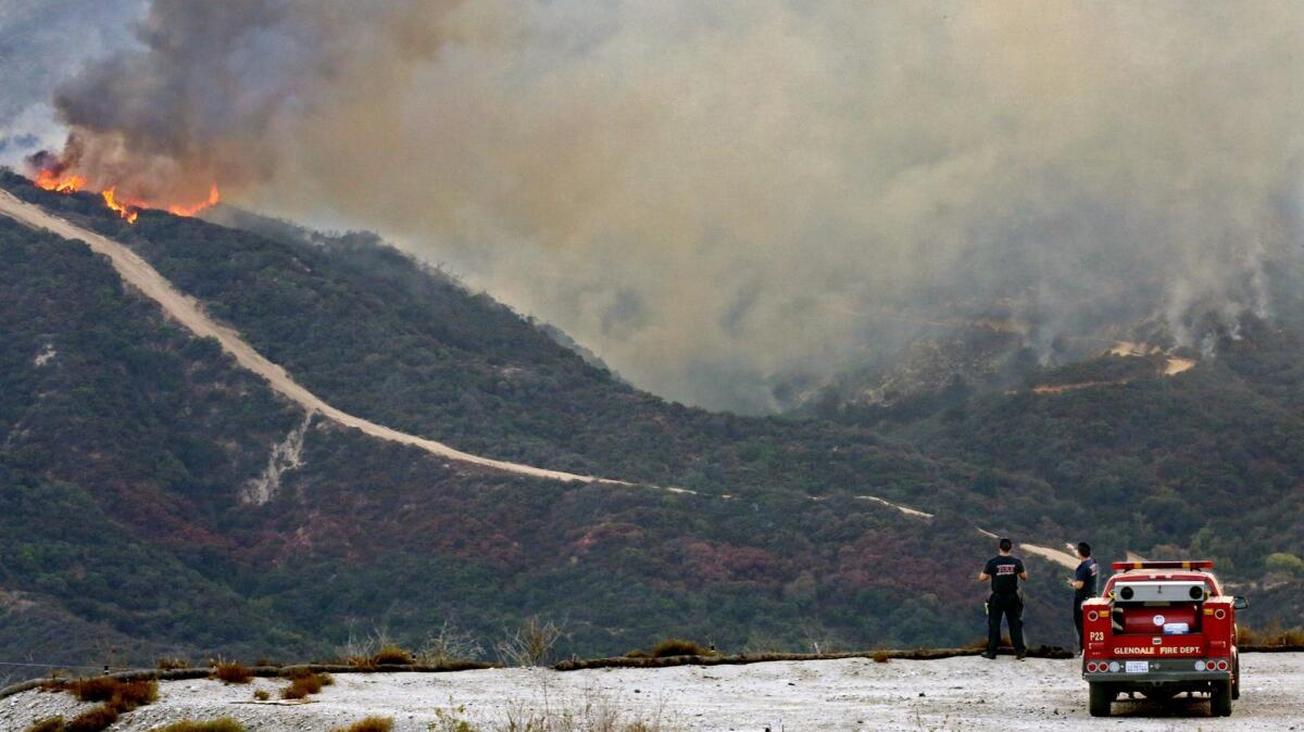Glendale fire personnel keep an eye on the La Tuna Fire in the Verdugo Mountains above La Crescenta from Deukmejian Wilderness Park in September 2017. Officials are warning residents to be prepared for potential mudslides in the area.