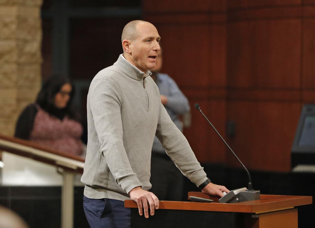 Olympic swimming gold medalist and Irvine native Jason Lezak speaks at Tuesday's special meeting.