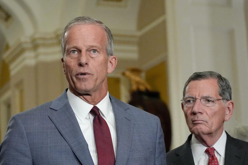 Sen. Majority Leader John Thune, R-S.D., left, speaks as Sen. John Barrasso, R-Wyo., listens during a news conference after a policy luncheon on Capitol Hill, Wednesday, July 29, 2026, in Washington. (AP Photo/Mariam Zuhaib)