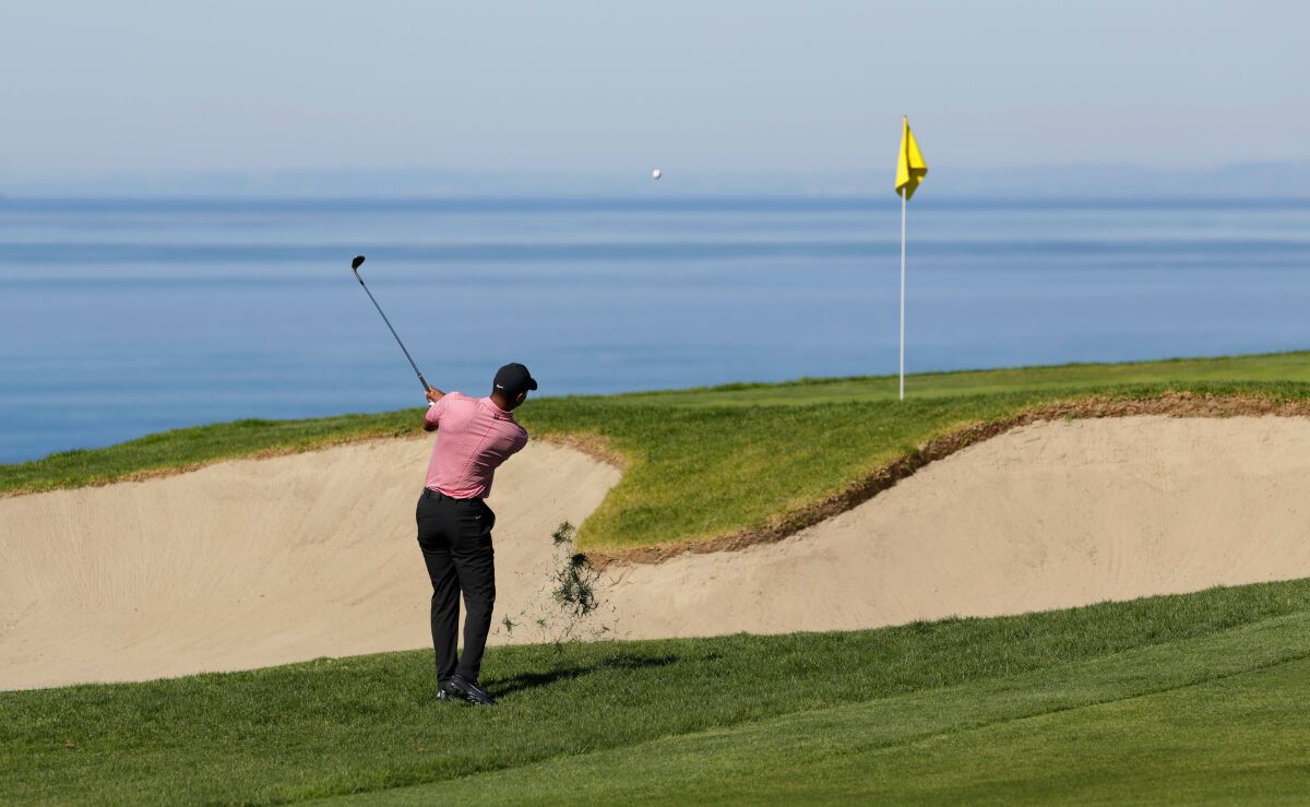 Tiger Woods hits on on the 4th hole during the fourth round of the Farmers Insurance Open at the Torrey Pines Golf Course on Jan. 27, 2019.