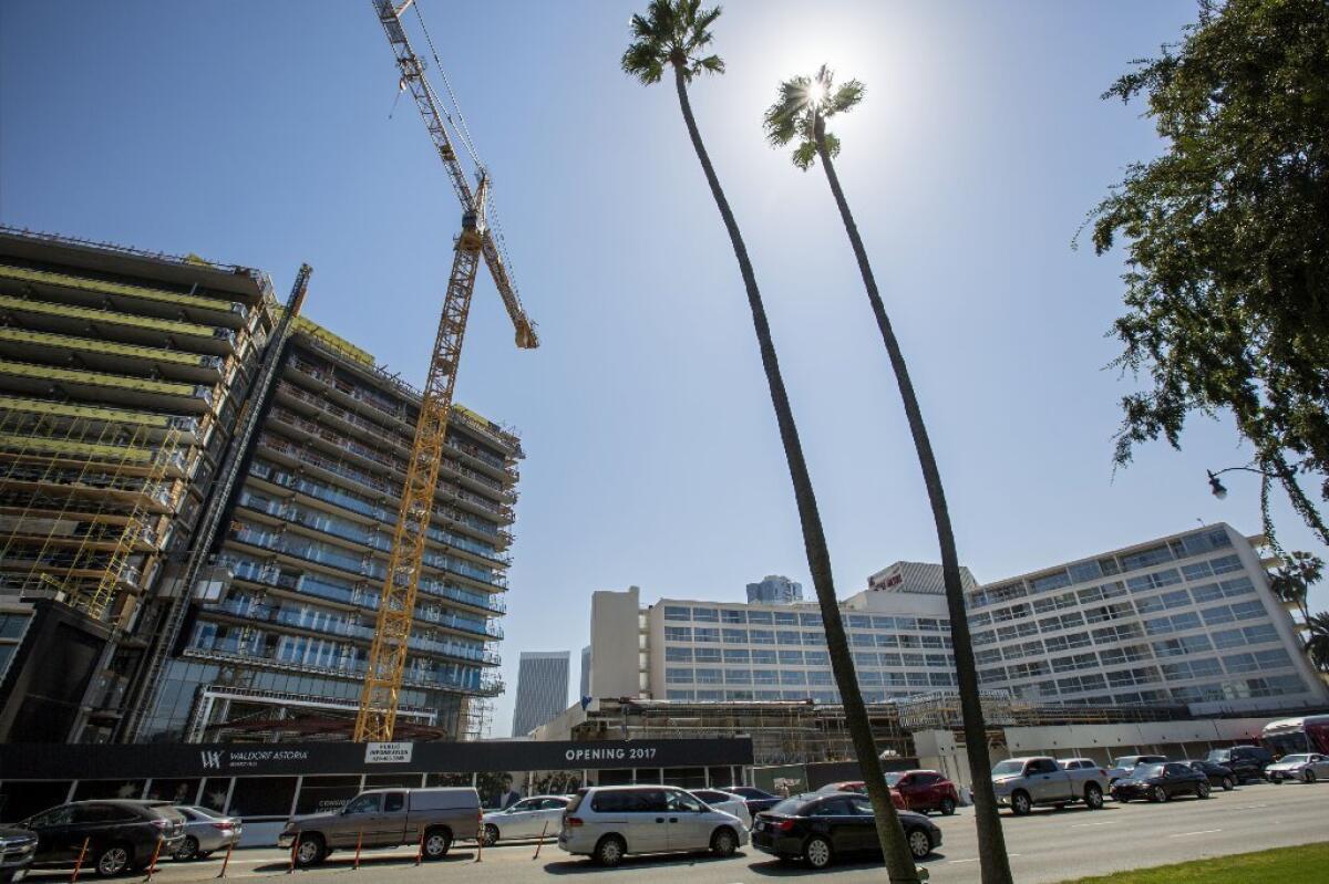 An increasingly tense dispute between two developers is roiling plans on a prime parcel of land adjoining Wilshire and Santa Monica boulevards in Beverly Hills.