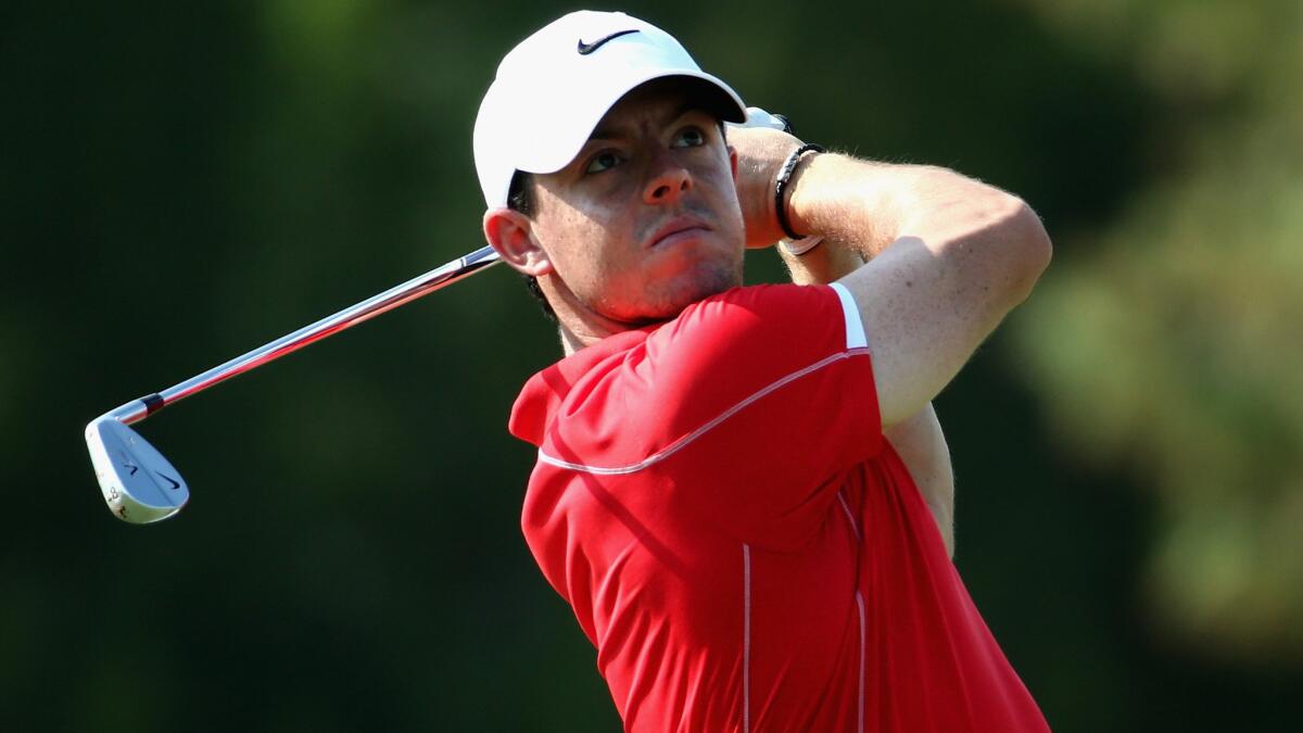 Rory McIlroy hits onto the seventh green during the first round of the DP World Tour Championship in Dubai on Thursday.