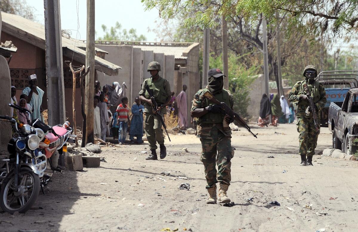 Nigerian troops patrol the streets of the remote northeast town of Baga in Borno state.
