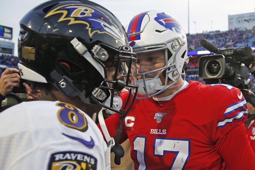 FILE - Buffalo Bills quarterback Josh Allen (17) talks with Baltimore Ravens quarterback Lamar Jackson (8) following a 24-17 Ravens win in an NFL football game in Orchard Park, N.Y., in this Sunday, Dec. 8, 2019, file photo. Buffalo's Josh Allen and Baltimore's Lamar Jackson become the first quarterbacks of the five-member 2018 first-round draft class set to meet in the playoffs as the Bills prepare to face the Ravens in the AFC divisional round on Saturday night, Jan. 16, 2021. (AP Photo/John Munson, File)