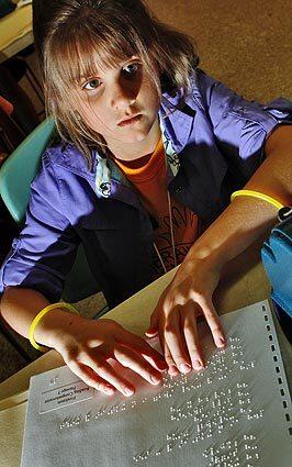 Kaitlyn Hall of Illinois takes a reading comprehension test as part of the 10th annual Braille Challenge, a national literacy contest held at the Braille Institute of America in Los Angeles. See full story