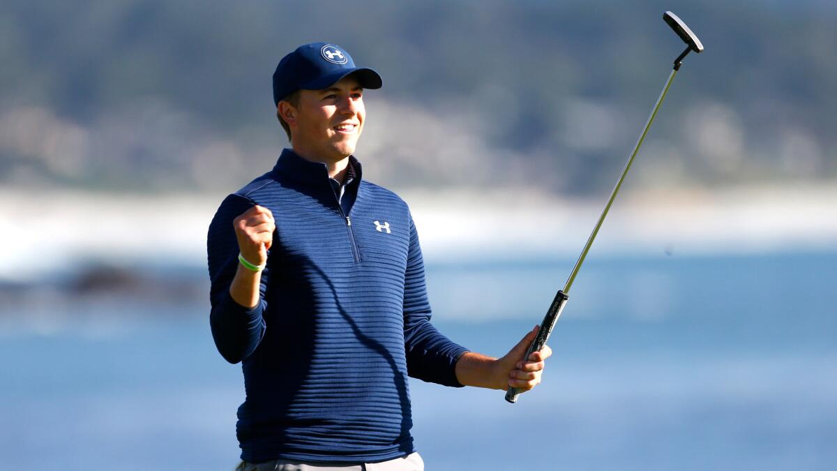 Jordan Spieth reacts after putting out on the 18th green to win the AT&T Pebble Beach Pro-Am on Sunday.