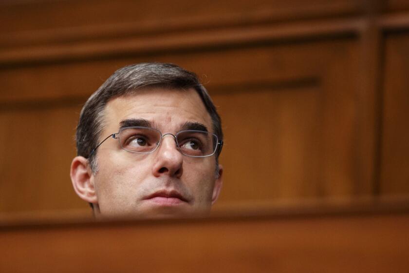 House Oversight and Reform National Security subcommittee member Rep. Justin Amash, R-Mich., watches from the dais on Capitol Hill in Washington, Wednesday, May 22, 2019, during the House Oversight and Reform National Security subcommittee hearing on "Securing U.S. Election Infrastructure and Protecting Political Discourse." (AP Photo/Carolyn Kaster)